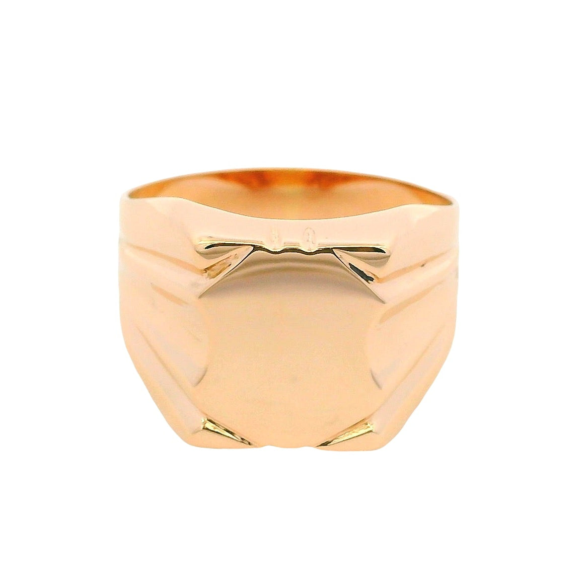 Gold ring with geometric design on a white background