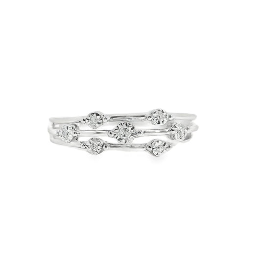 Set of silver rings with floral designs on a white background
