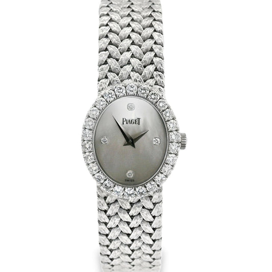 Silver watch with diamond-studded bezel on a white background