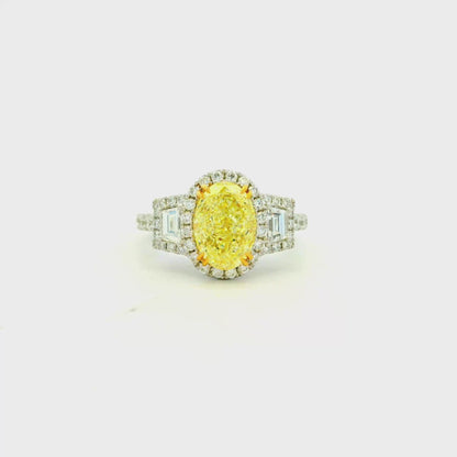 18k White and Yellow GIA 2.06ctw Oval Cut Fancy Yellow Diamond and 1.15ctw Diamond Ring