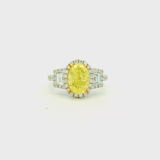 18k White and Yellow GIA 2.06ctw Oval Cut Fancy Yellow Diamond and 1.15ctw Diamond Ring