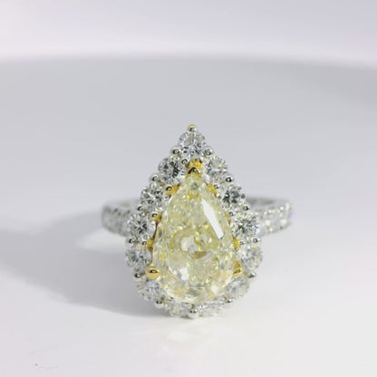 18k White and Yellow Gold 2.66ctw Pear Cut Yellow Diamond and 1.96ctw Accent Round Diamond Ring