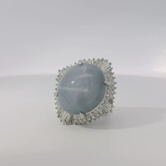 Platinum 46.44ct Sapphire Star accented by 1.52ct Round Brilliant and Baguette Diamond Ring