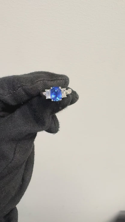 Platinum 3 Stone Ring set with Natural Cushion Blue Sapphire and Emerald Cut Diamond Side Stones