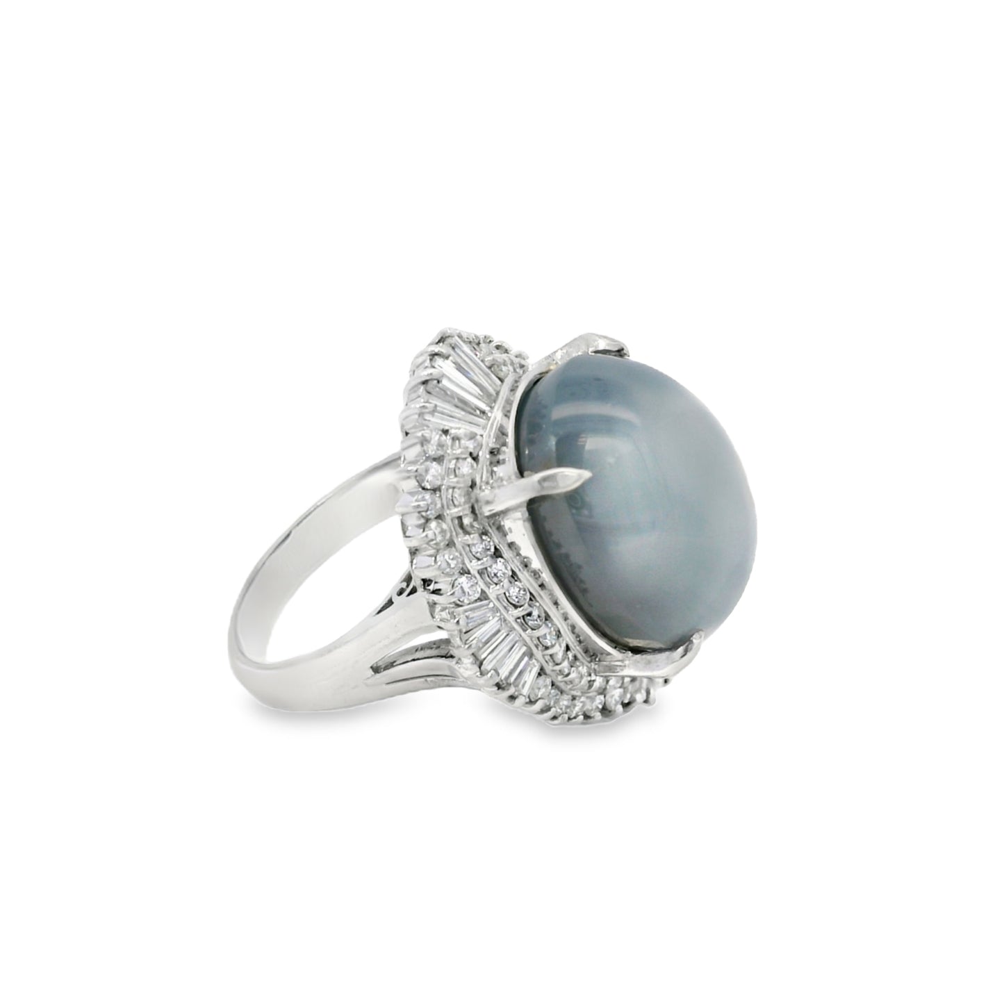 Platinum 46.44ct Sapphire Star accented by 1.52ct Round Brilliant and Baguette Diamond Ring