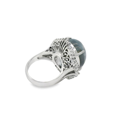 Platinum 46.44ct Sapphire Star accented by 1.52ct Round Brilliant and Baguette Diamond Ring