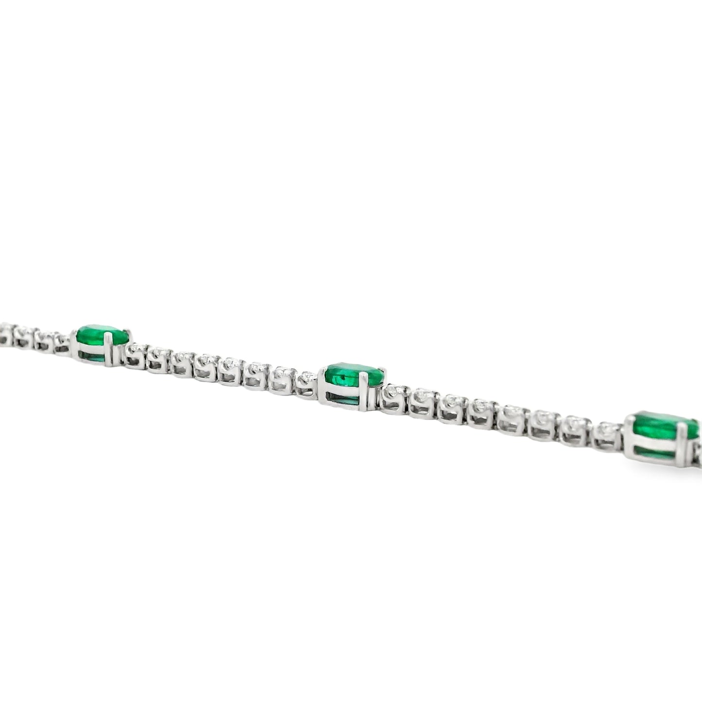 14k White Gold 5.88ctw Oval Emerald and Round Brilliant Diamond Tennis Bracelet — front view, clasp closed