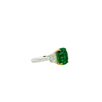 Platinum & 18k Yellow Gold 5.90ct Cushion Cut Vivid Green Emerald and Diamond Three-Stone Ring — left three-quarter angle