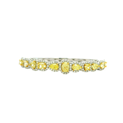 18k Two-Tone Gold 6.37ctw Multi-Shape Natural Yellow & White Diamond Bangle Bracelet — left three-quarter angle