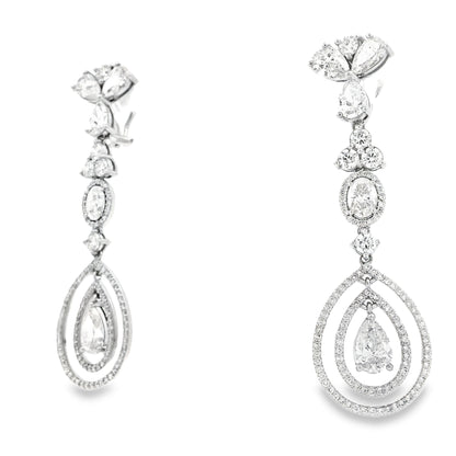 18k White Gold 12.68ctw Pear Oval and Round Brilliant Diamond Drop Earrings — left three-quarter angle