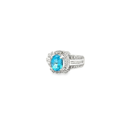 White Gold Oval Blue Gemstone Halo Cocktail Ring — left three-quarter angle