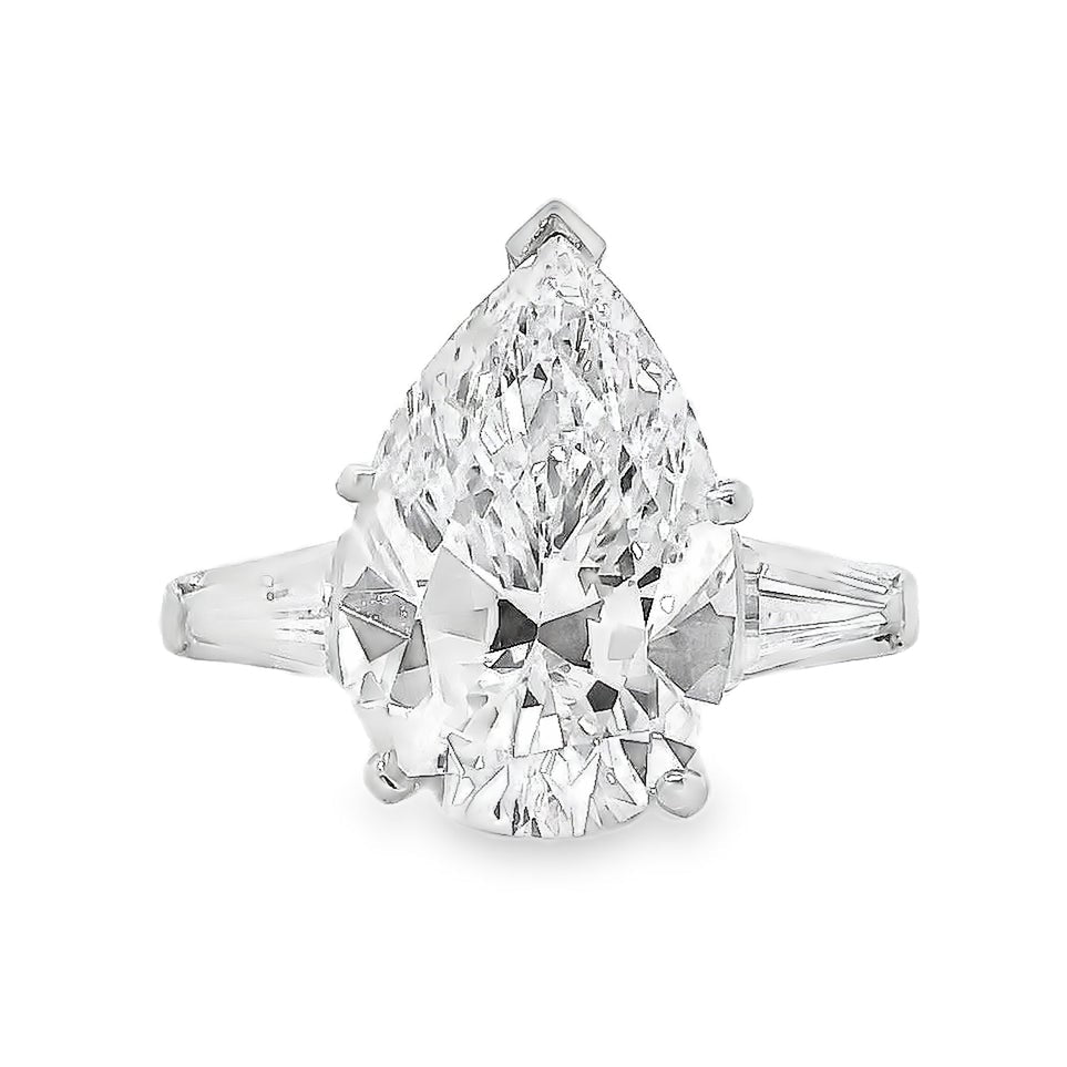 Platinum 4.69ct GIA Pear Cut Diamond Tapered Baguette Three-Stone Engagement Ring — left three-quarter angle