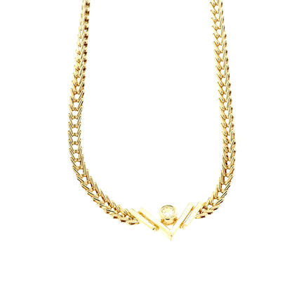14k Yellow Gold V-Shaped Pendant Necklace with 0.10ct Round Diamond — macro detail of the stones