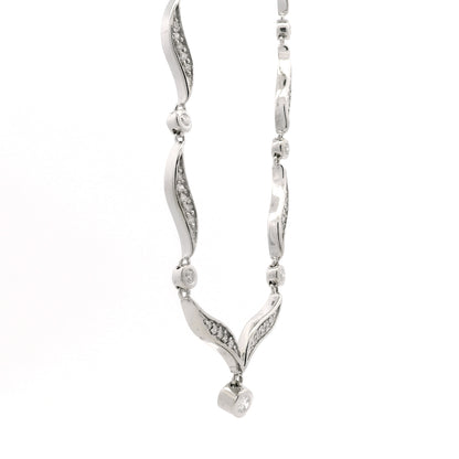 14k White Gold 0.90ctw Round Brilliant Diamond V-Shaped Necklace — macro detail of the dial