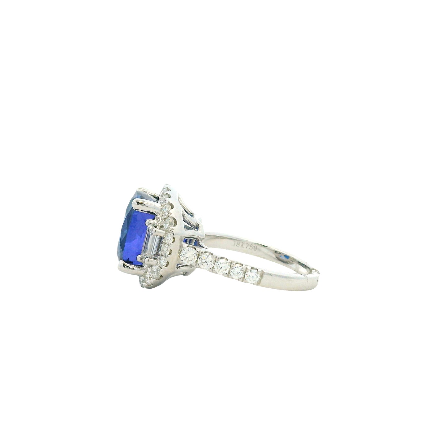 18k White Gold 8.45ct Cushion Cut Tanzanite and 1.55ctw Diamond Three-Stone Cocktail Ring — worn on the finger