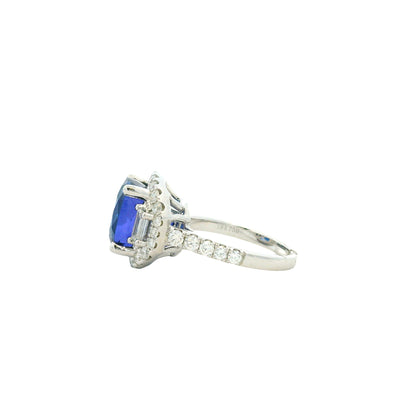 18k White Gold 8.45ct Cushion Cut Tanzanite and 1.55ctw Diamond Three-Stone Cocktail Ring — worn on the finger