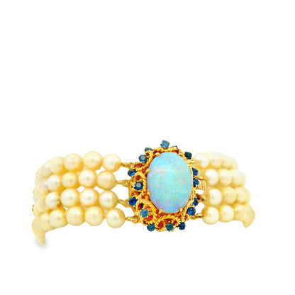 14k Yellow Gold 4-Strand Natural Pearl Bracelet with Opal and Natural Sapphire Cluster Centerpiece — worn on the finger