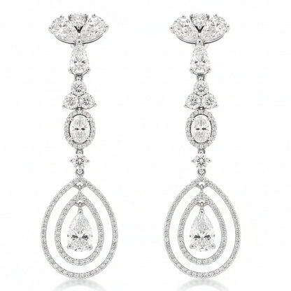 18k White Gold 12.68ctw Pear Oval and Round Brilliant Diamond Drop Earrings — worn on the finger