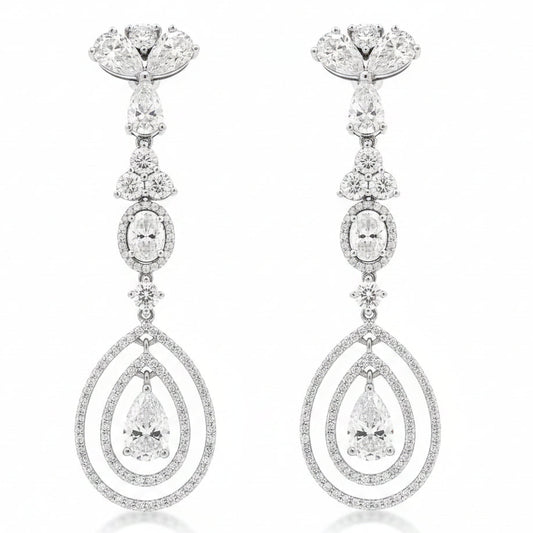 18k White Gold 12.68ctw Pear Oval and Round Brilliant Diamond Drop Earrings — worn on the finger