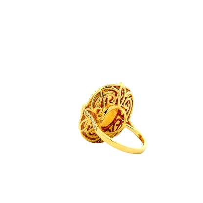 14k Yellow Gold 12.47ct Oval Opal and 0.66ctw Diamond Halo Cocktail Ring — worn on the finger