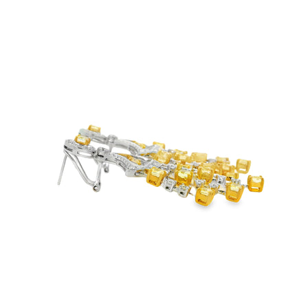 18k Two-Tone Gold 5.86ct Fancy Yellow and 2.71ctw Round Brilliant Diamond Dangle Earrings — worn on the ear