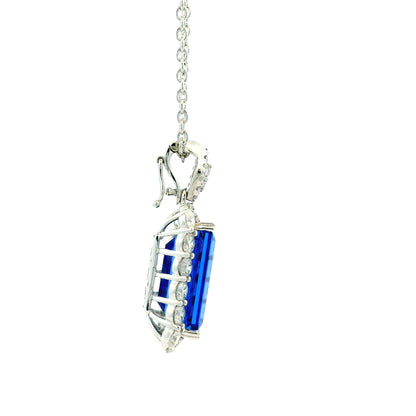 14k White Gold 13.50ct Emerald Cut Tanzanite & 2.54ctw Round Brilliant Diamond Halo Pendant Necklace — worn at the neckline