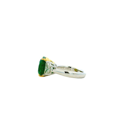 Platinum & 18k Yellow Gold 5.90ct Cushion Cut Vivid Green Emerald and Diamond Three-Stone Ring — worn on the finger