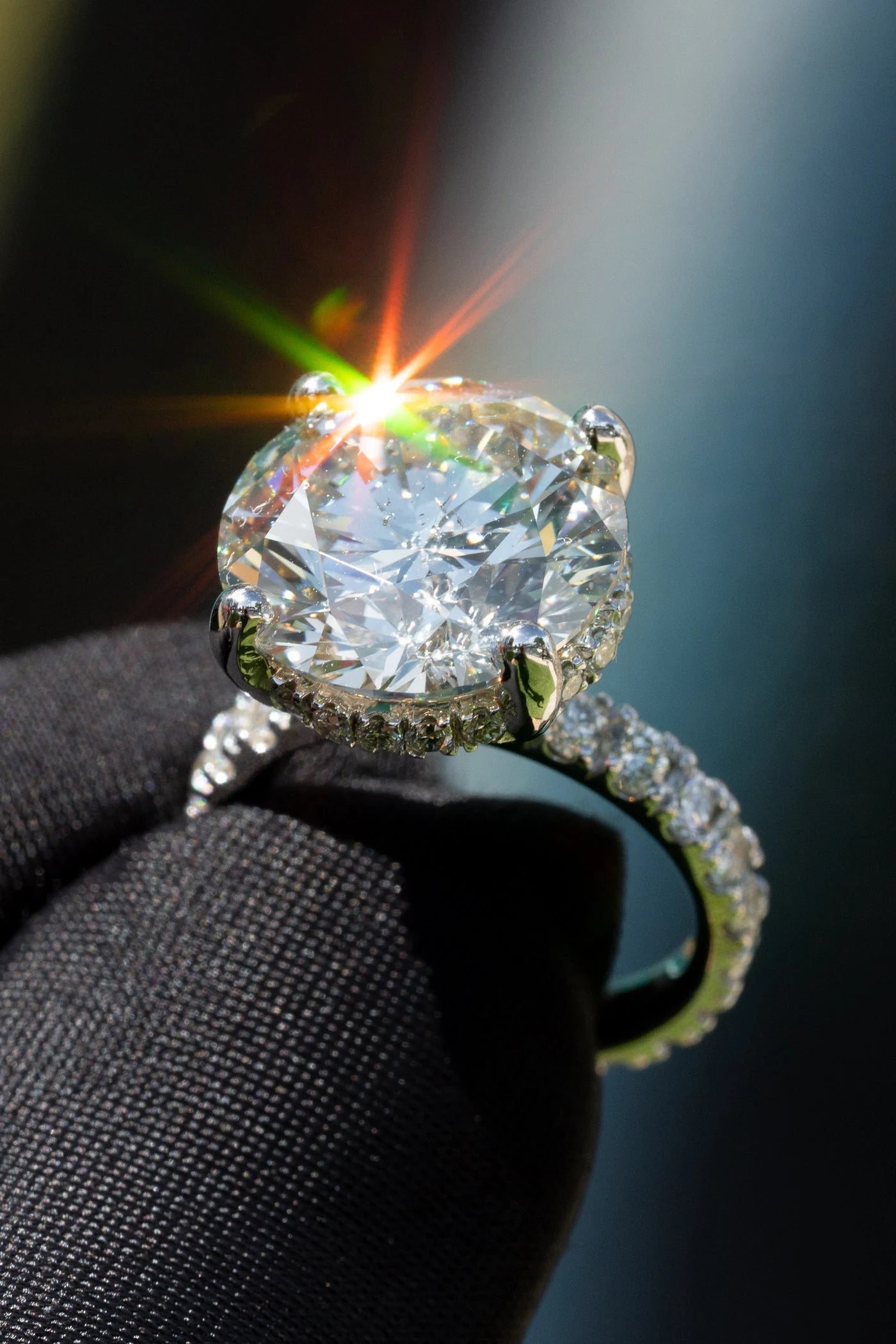 Ring with a large round center stone and a stone set band