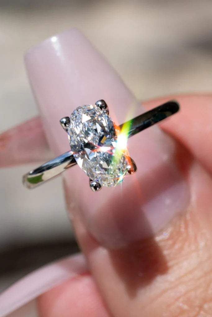 Oval center stone ring in a simple prong setting
