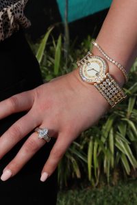yellow gold timepiece and bracelet
