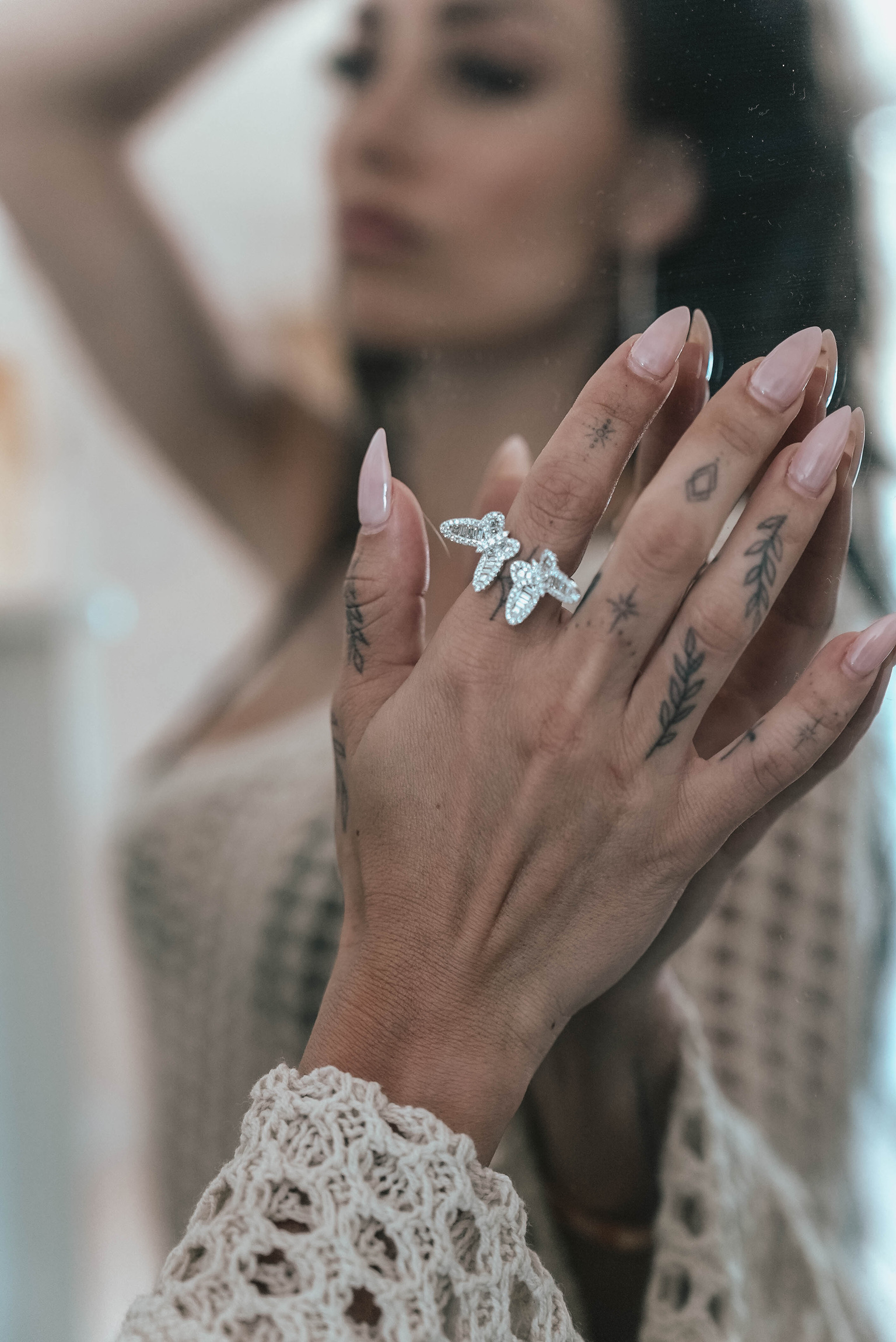 A beautiful model rocking a white diamond butterfly ring