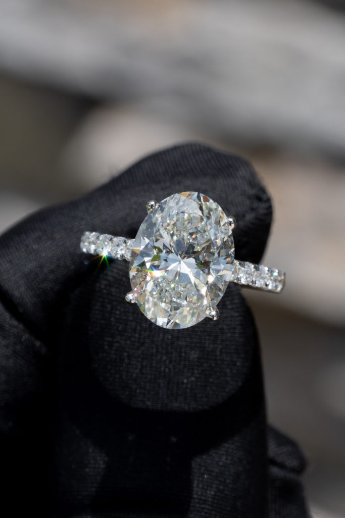 a white sapphire in an engagement ring