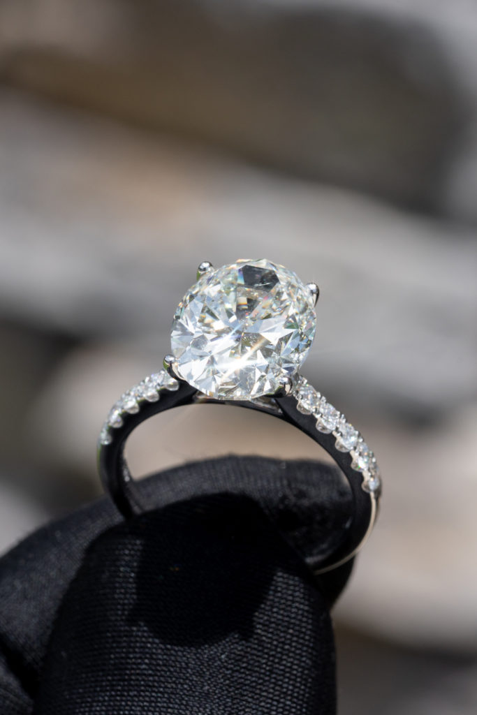 close up of oval diamond in an engagement ring