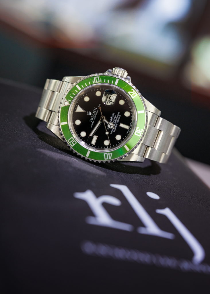 Rolex Submariner with Green Bezel Diamonds by Raymond Lee